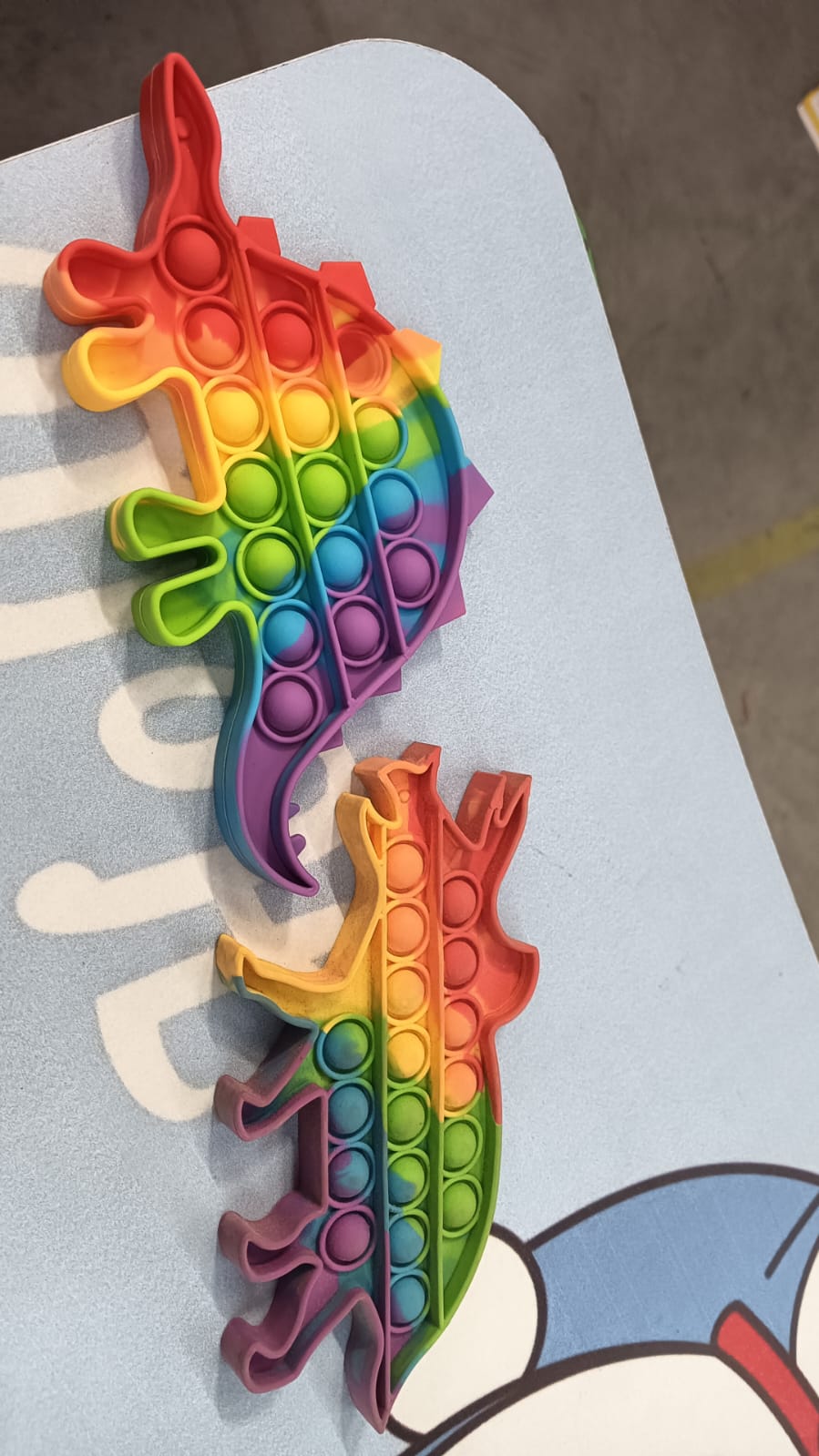Wukusy 4755 Mix Pattern Rainbow Color Push Pop Bubble Fidget Toy showing colorful silicone bubbles for sensory play.
