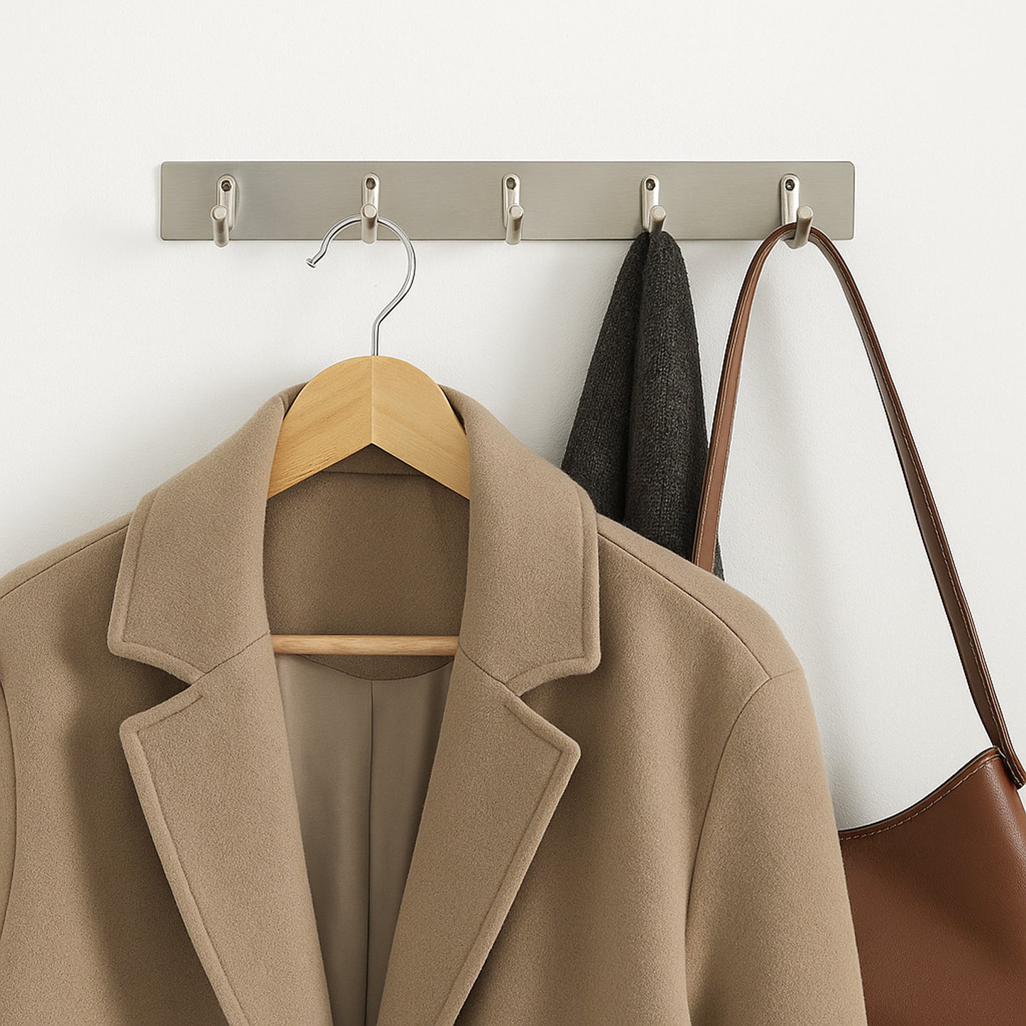 Wall-mounted stainless steel coat rack with five hooks, 26 inches long, ideal for home and kitchen organization.
