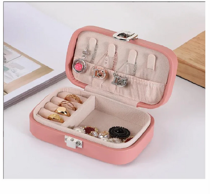 Drpshippr travel jewelry case and organizer with multiple compartments for storing necklaces, rings, and earrings during travel.
