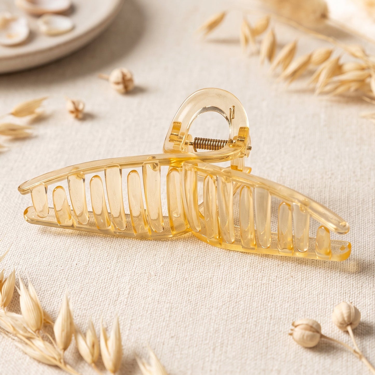 Transparent plastic hair clip by Wukusy, a stylish claw clutcher for women, shown in a close-up view.