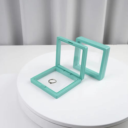 Wukusy transparent jewelry display box, 9x9 cm, showcasing a clear, compact case for organizing and presenting jewelry items.