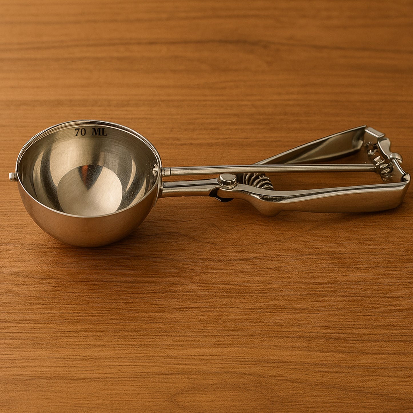 Wukusy stainless steel ice cream scoop with trigger release, 70ml capacity, showing the scoop with trigger mechanism and polished finish.