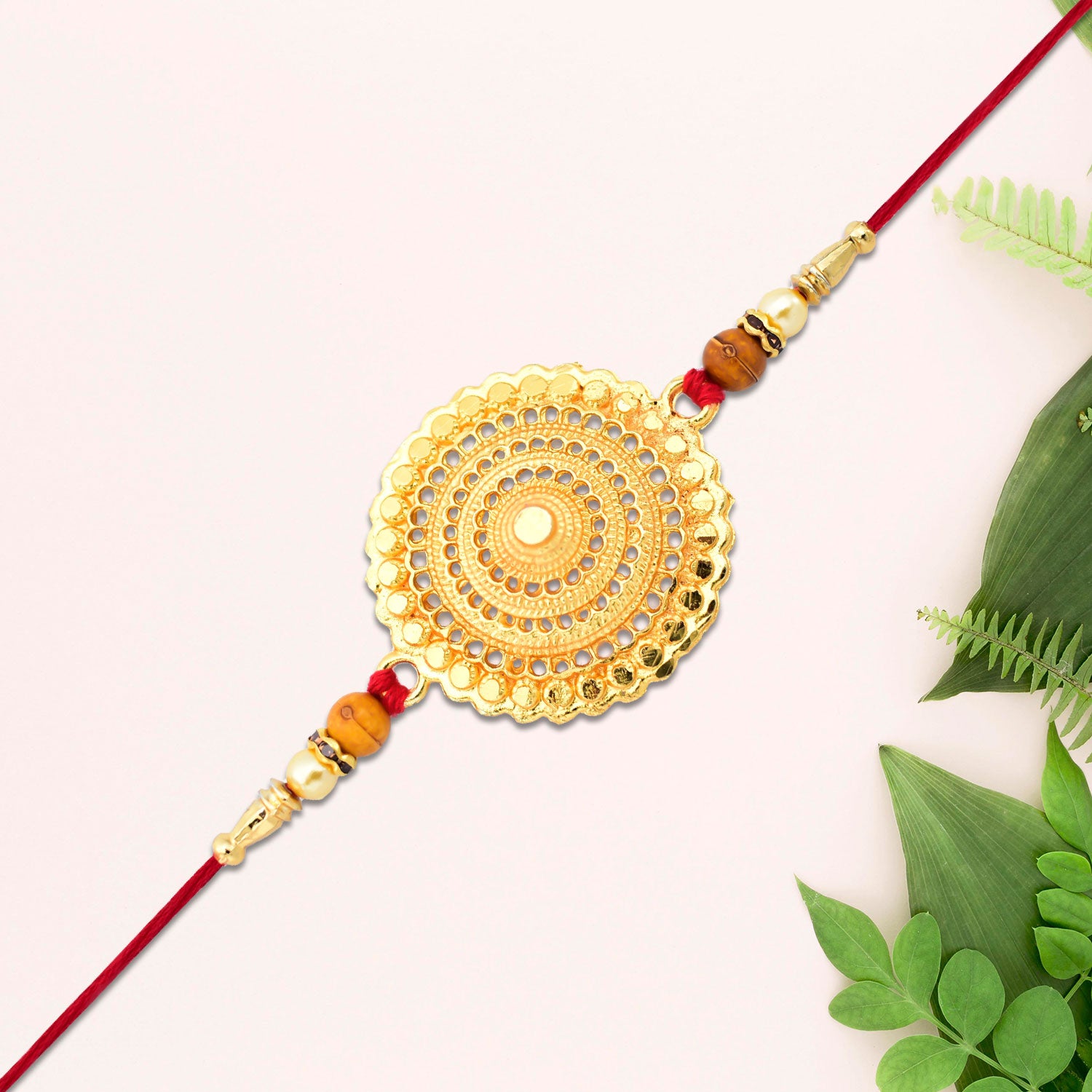 Golden Mandala Designer Rakhi by Wukusy featuring intricate mandala patterns and vibrant gold accents for festive celebrations.
