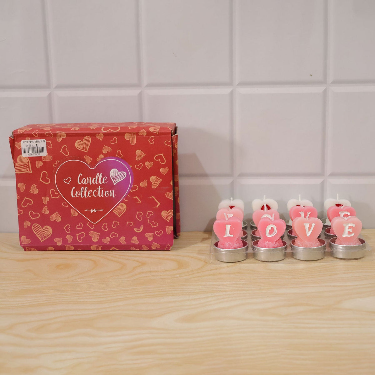 Set of 12 Wukusy heart-shaped love tealight candles for romantic table decoration, featuring warm glowing candle flames.