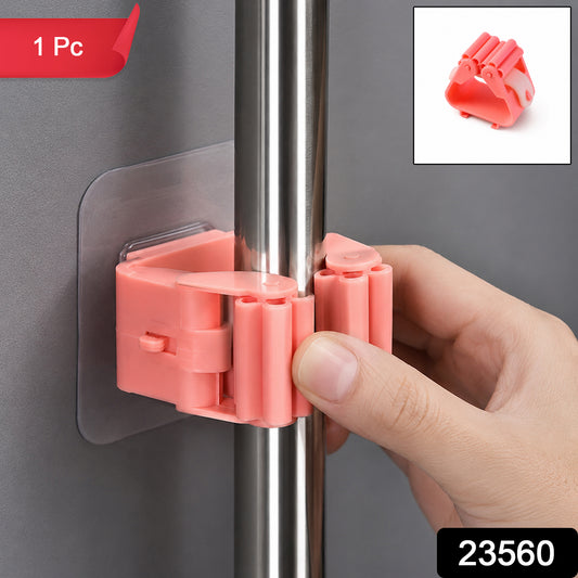 Wall-mounted plastic broom holder clip by Wukusy, designed for organizing mops and brooms in a convenient storage solution.