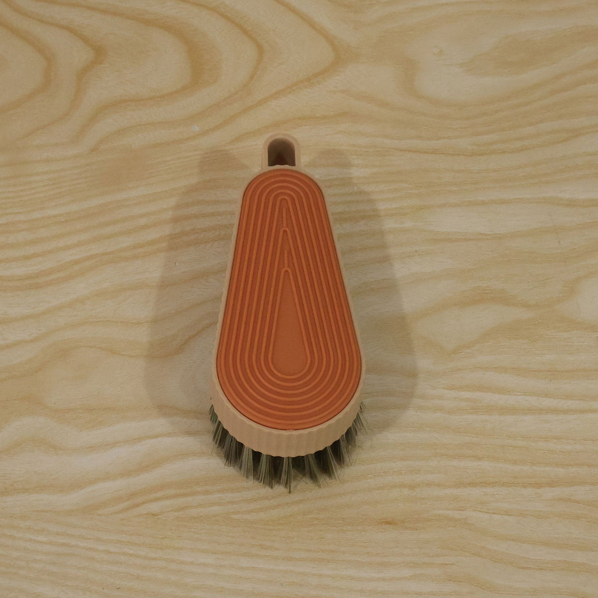 Wukusy multipurpose cleaning brush with textured grip, suitable for shoes and tiles, shown in close-up image.
