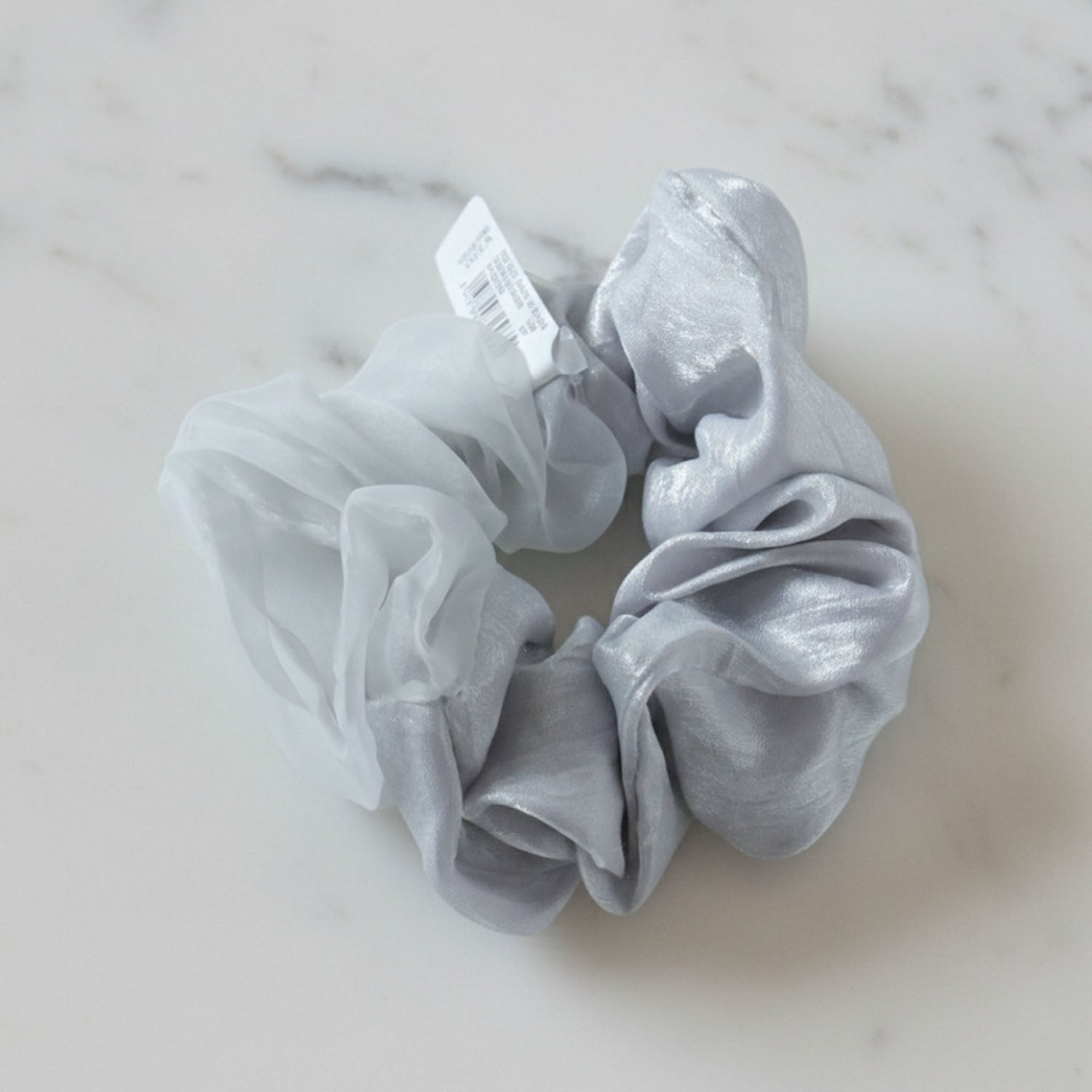 Wukusy dual-tone satin mesh fabric hair scrunchie on a white background, showcasing its soft, shiny material and elastic band.