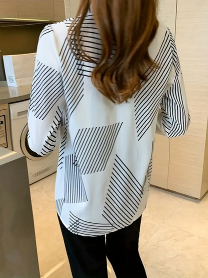 Woman wearing a printed cotton silk long sleeve collar neck tunic shirt from Drpshippr's men's collection