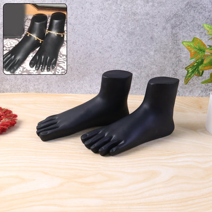 Pair of black foot mannequin display stands by Wukusy, used as accessories for showcasing footwear or fashion items.