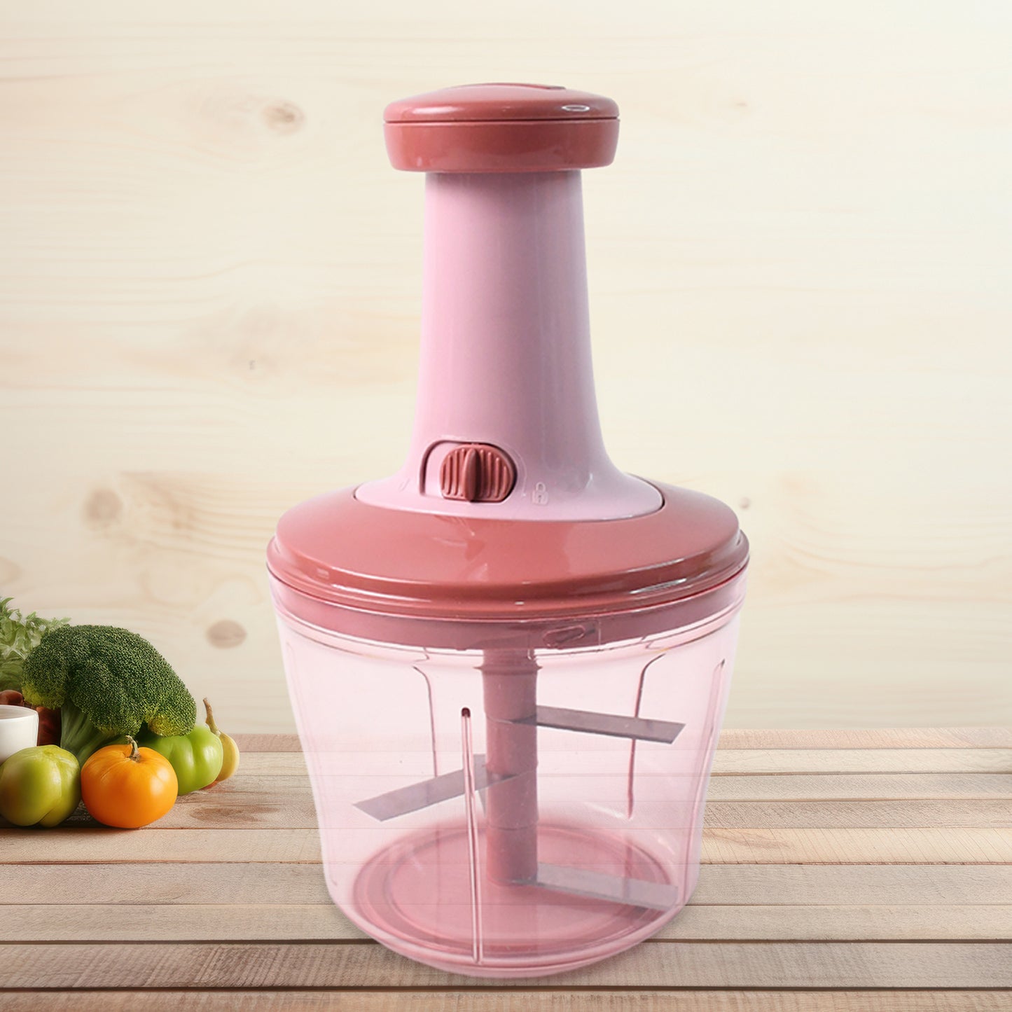 Wukusy Apex Quba Push Chopper with stainless steel blades, 1000ml capacity, showing the compact kitchen gadget with chopping blades.