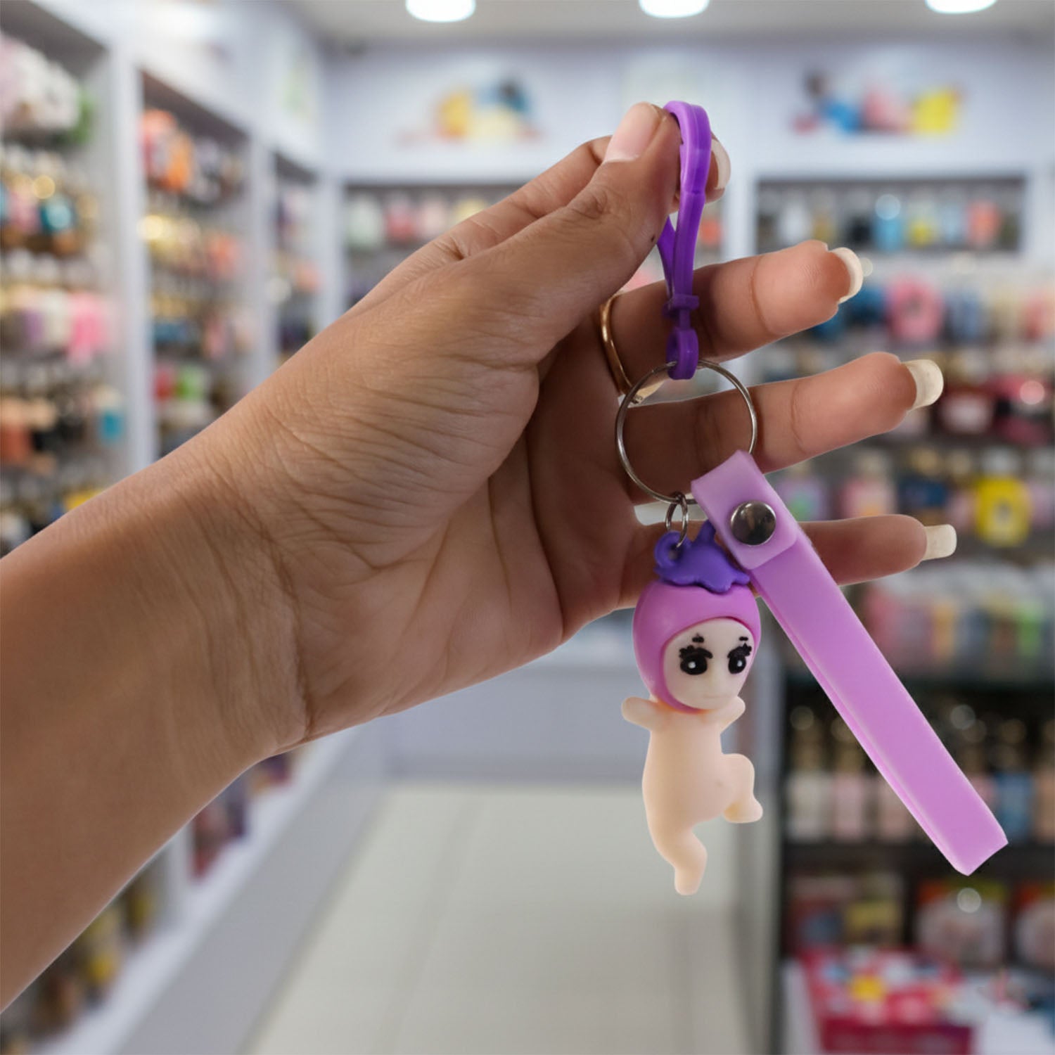 Wukusy cute baby doll cartoon silicone keychain, colorful and playful accessory, featuring a charming baby doll design on a keyring.