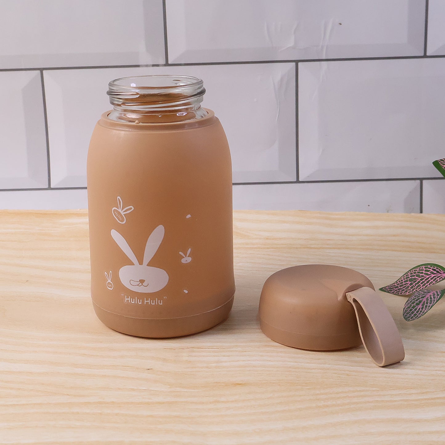 Wukusy cute bunny print glass drinking bottle in brown with 330ml capacity, featuring adorable bunny design on the surface.