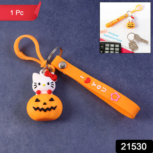 Cute cartoon cat pumpkin-themed silicone keychain from Wukusy, featuring a colorful feline design on a small, durable accessory.
