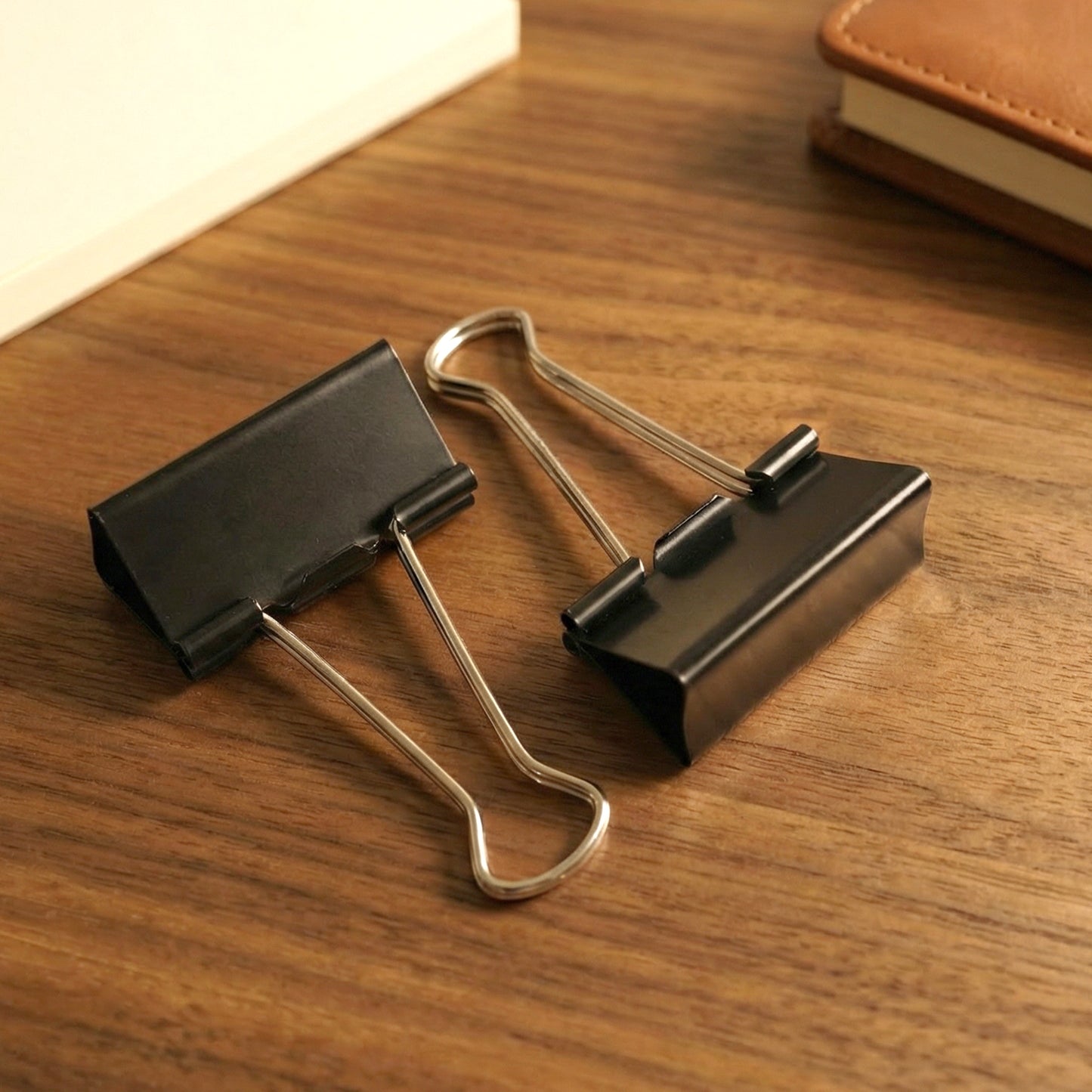 Set of 12 extra large black binder clips by Wukusy, 41 mm heavy-duty metal clips for securing documents.
