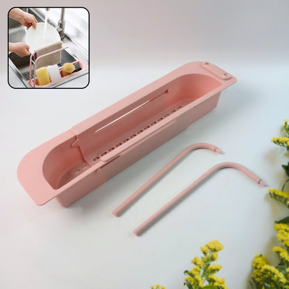 Wukusy over-sink expandable sink caddy with dual towel bar and drip tray, holding kitchen sponges and dish soap