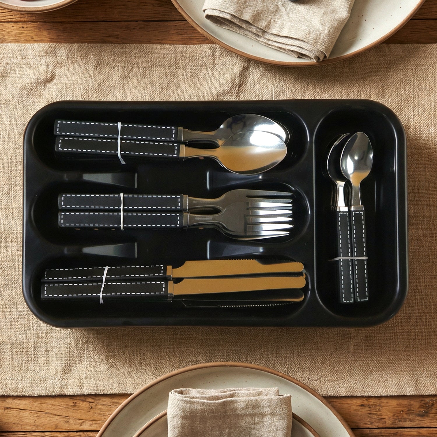Wukusy 24-piece stainless steel cutlery set with plastic handles and tray, includes knives, forks, and spoons for kitchen use.
