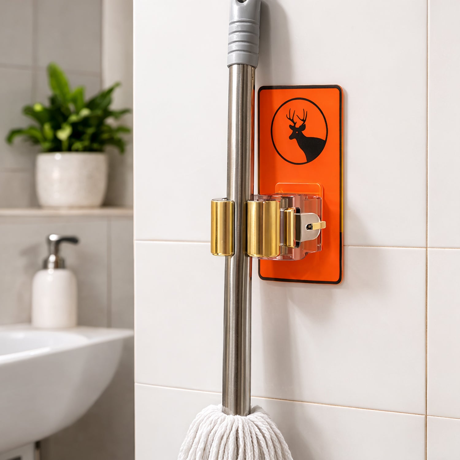 Wukusy wall-mounted mop holder clip for bathroom and kitchen, designed to hold brooms and mops securely on the wall.