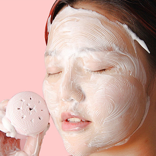 Wukusy facial cleansing brush featuring a cute octopus-shaped silicone face scrubber and skincare massager in a playful design.