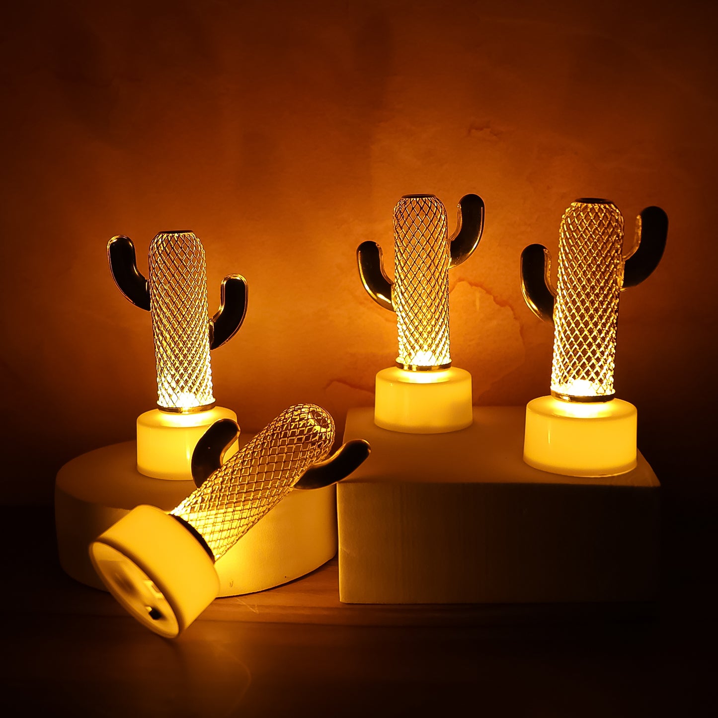 Set of four cactus-shaped flameless LED candles for home decor by Wukusy, featuring realistic cactus designs and warm ambient lighting.