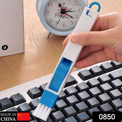 Wukusy 0850 2-in-1 multi-function plastic cleaning brush for window slots, keyboards, and wardrobes, removing dust effectively.
