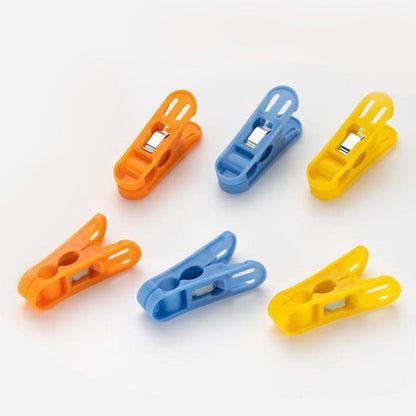 Set of 12 multicolour Wukusy cloth drying non-slip plastic clips for home laundry, lightweight and durable.