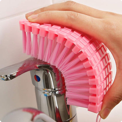 Wukusy flexible plastic cleaning brush for kitchen and bathroom cleaning, with a comfortable handle and durable bristles.