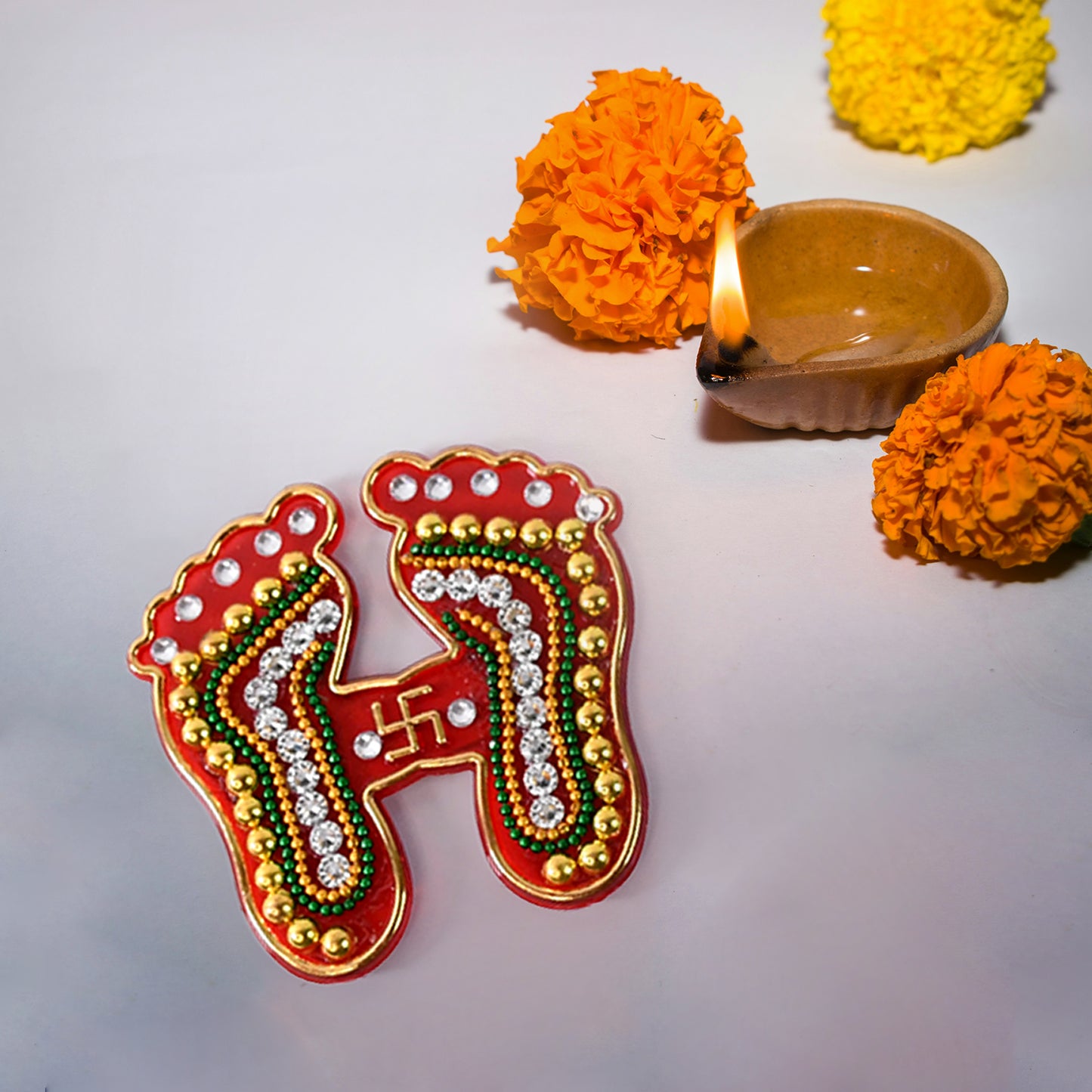 Decorative Laxmi Charan Paduka sticker set by Wukusy, featuring two elegant home decor stickers with traditional design.