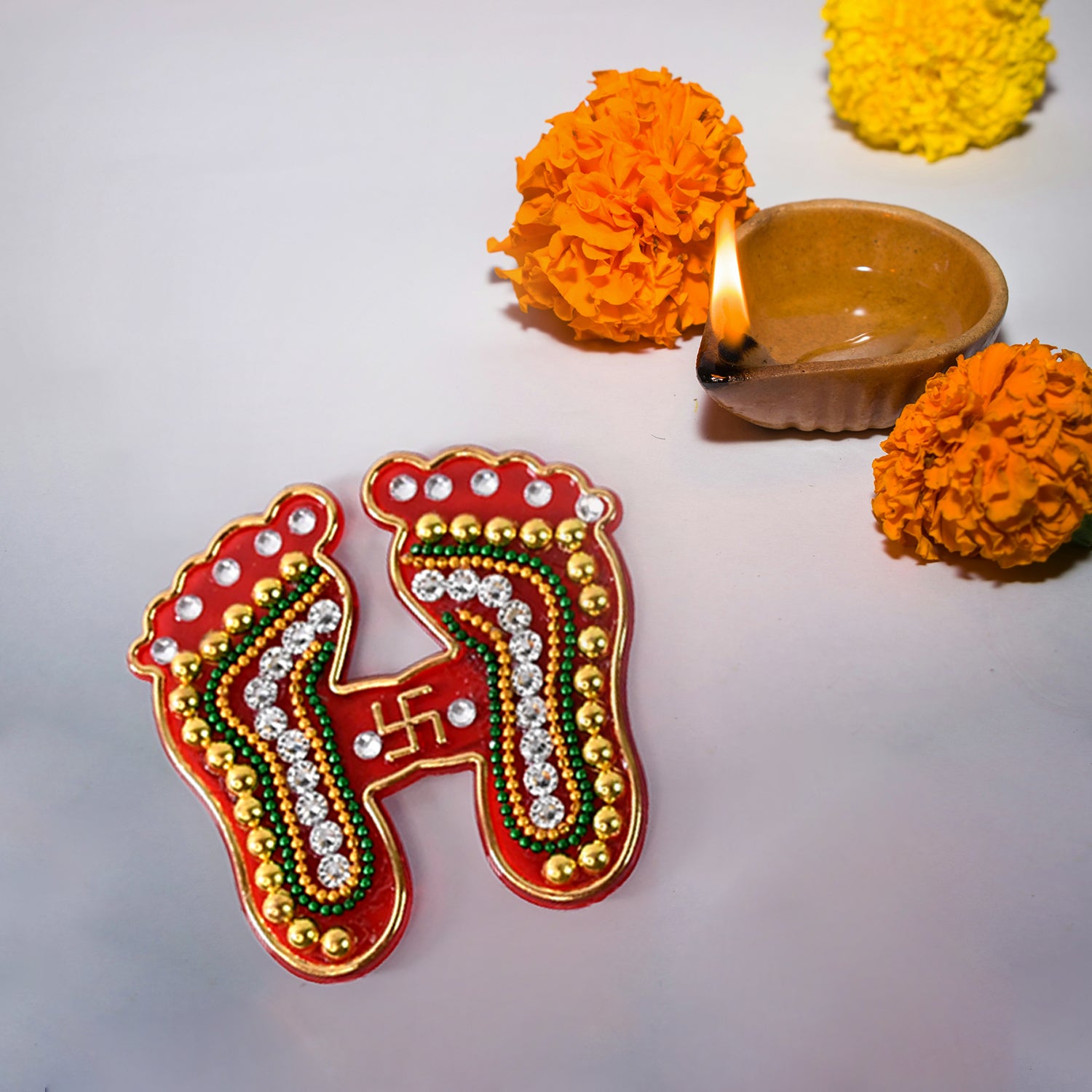 Decorative Laxmi Charan Paduka sticker set by Wukusy, featuring two elegant home decor stickers with traditional design.