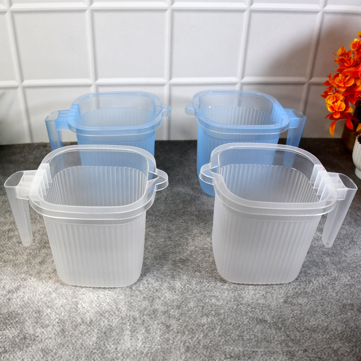 Set of four transparent plastic bathroom water mugs in mixed colors, each 1000 ml, by Wukusy for home improvement.