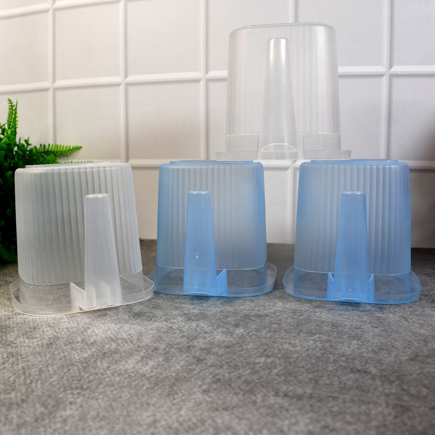Set of four Wukusy plastic transparent bathroom water mugs in mixed colors, each 1000ml capacity for home improvement use.