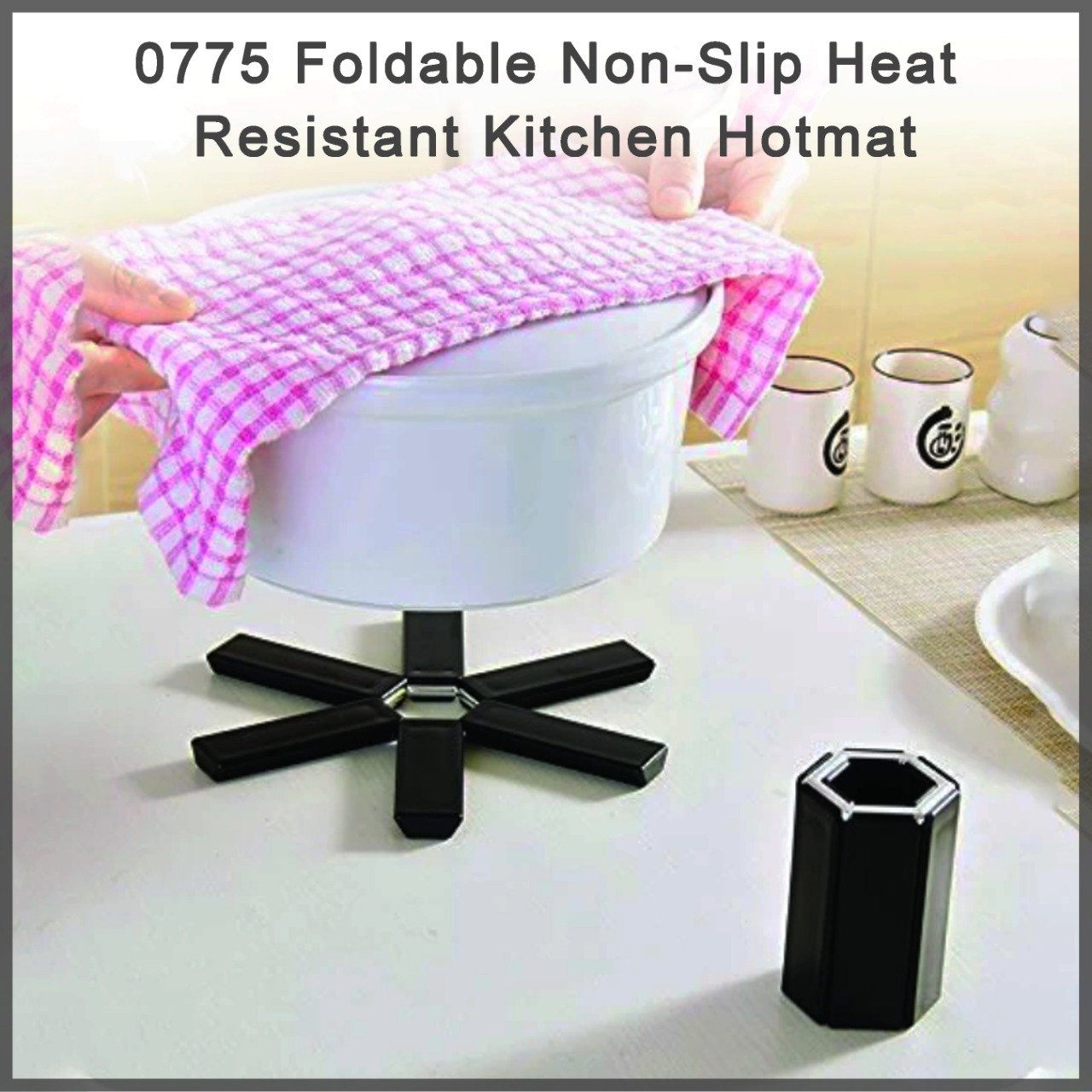 Wukusy foldable non-slip heat-resistant kitchen hotmat on countertop, designed for protecting surfaces from hot cookware.