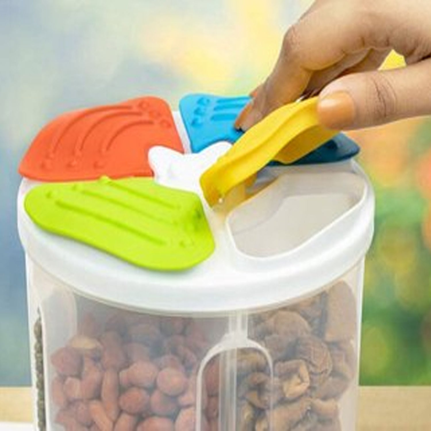 Wukusy 4-section transparent plastic food storage container with airtight lid for kitchen organization and freshness.