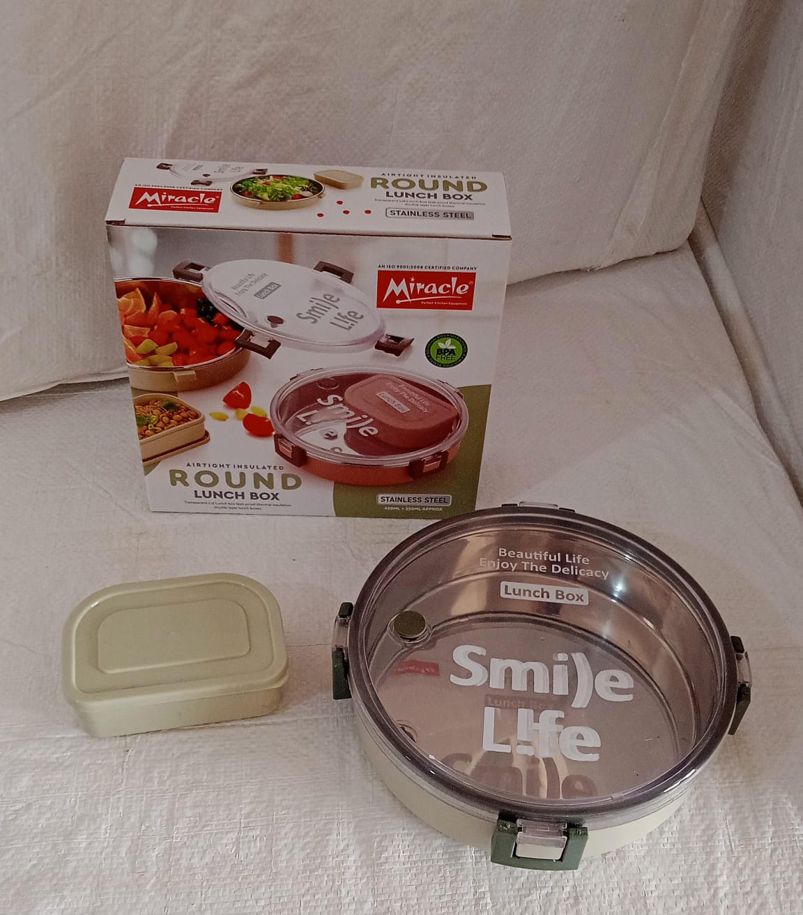 Wukusy Miracle stainless steel round lunch box with transparent lid, includes small plastic insert, leak-proof for kids and adults.