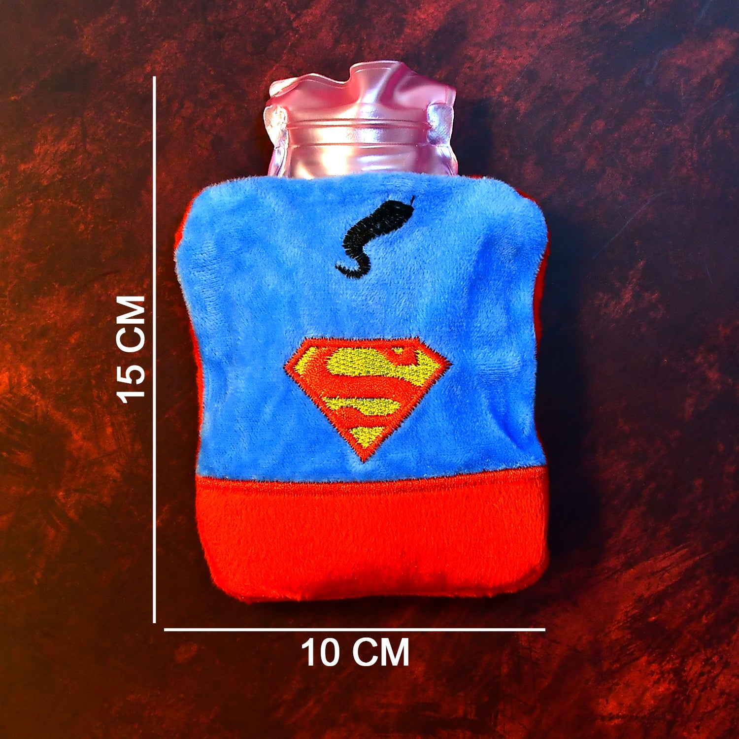 Small Superman print hot water bag with cover from Wukusy, used for pain relief, neck, shoulder, hand, feet warming, and menstrual cramps.
