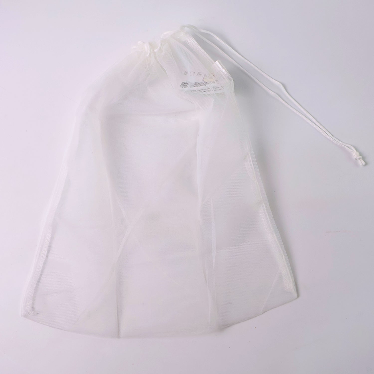 Reusable transparent mesh storage bag with drawstring closure by Wukusy, ideal for organizing home and kitchen items.