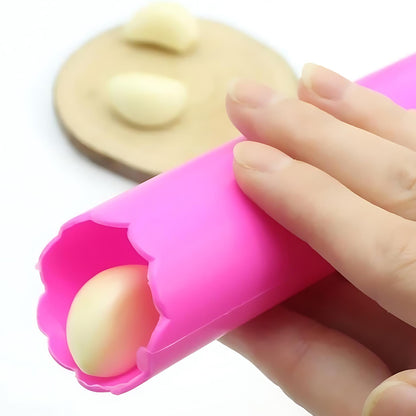 Wukusy silicone garlic peeler tube and hand roller peeling tool for easy garlic skin removal in the kitchen.