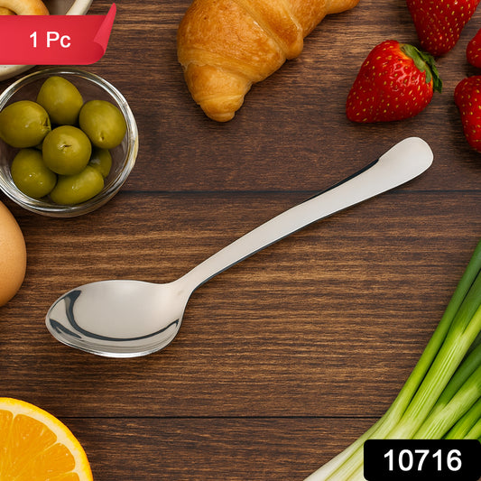 Stainless steel baby dining spoon by Wukusy, designed for infants, with a small ergonomic handle and rounded spoon bowl.