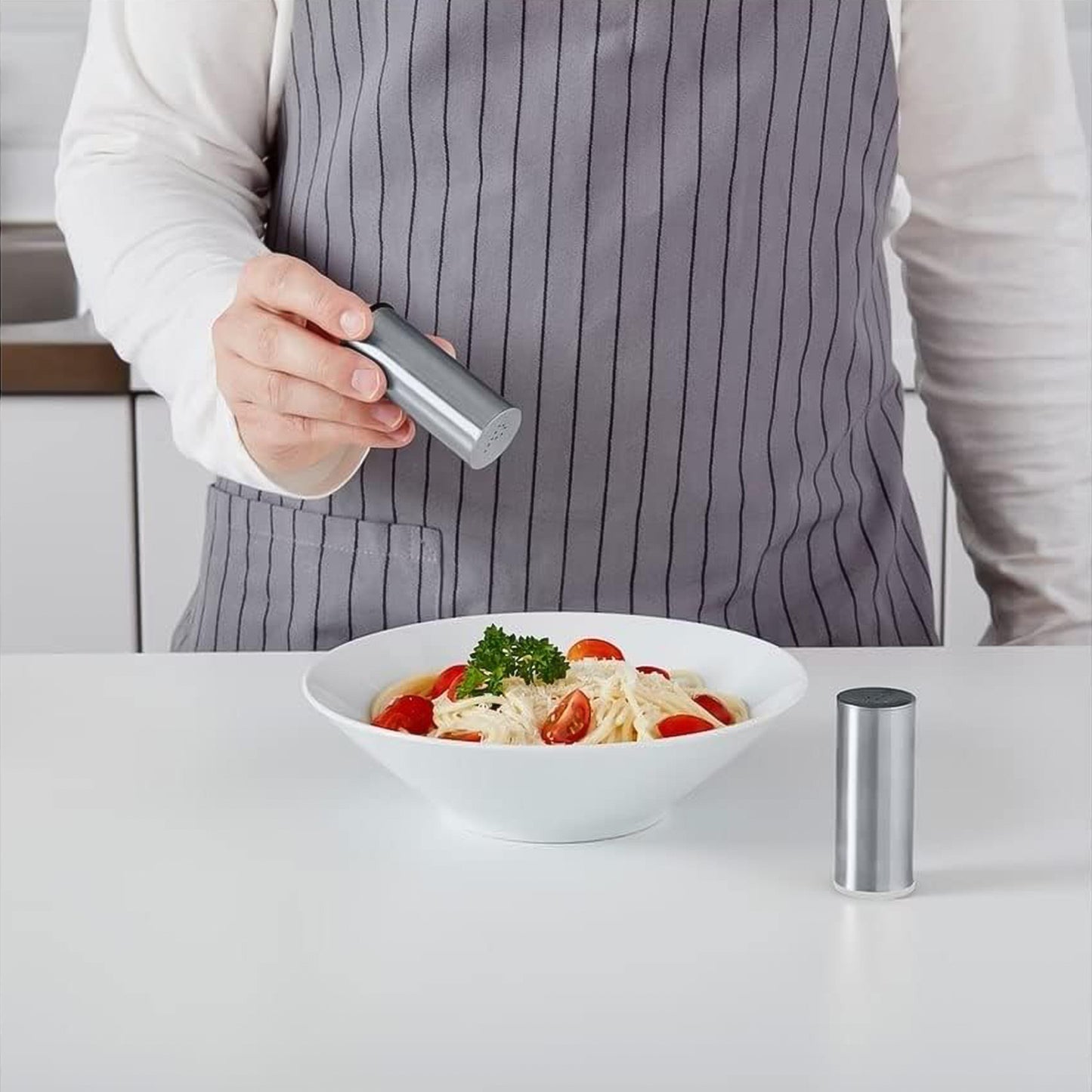 Wukusy stainless steel salt and pepper shaker set with two shakers for kitchen seasoning.