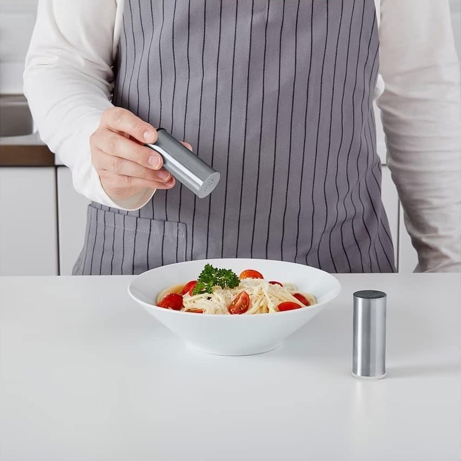 Wukusy stainless steel salt and pepper shaker set with two shakers for kitchen seasoning.