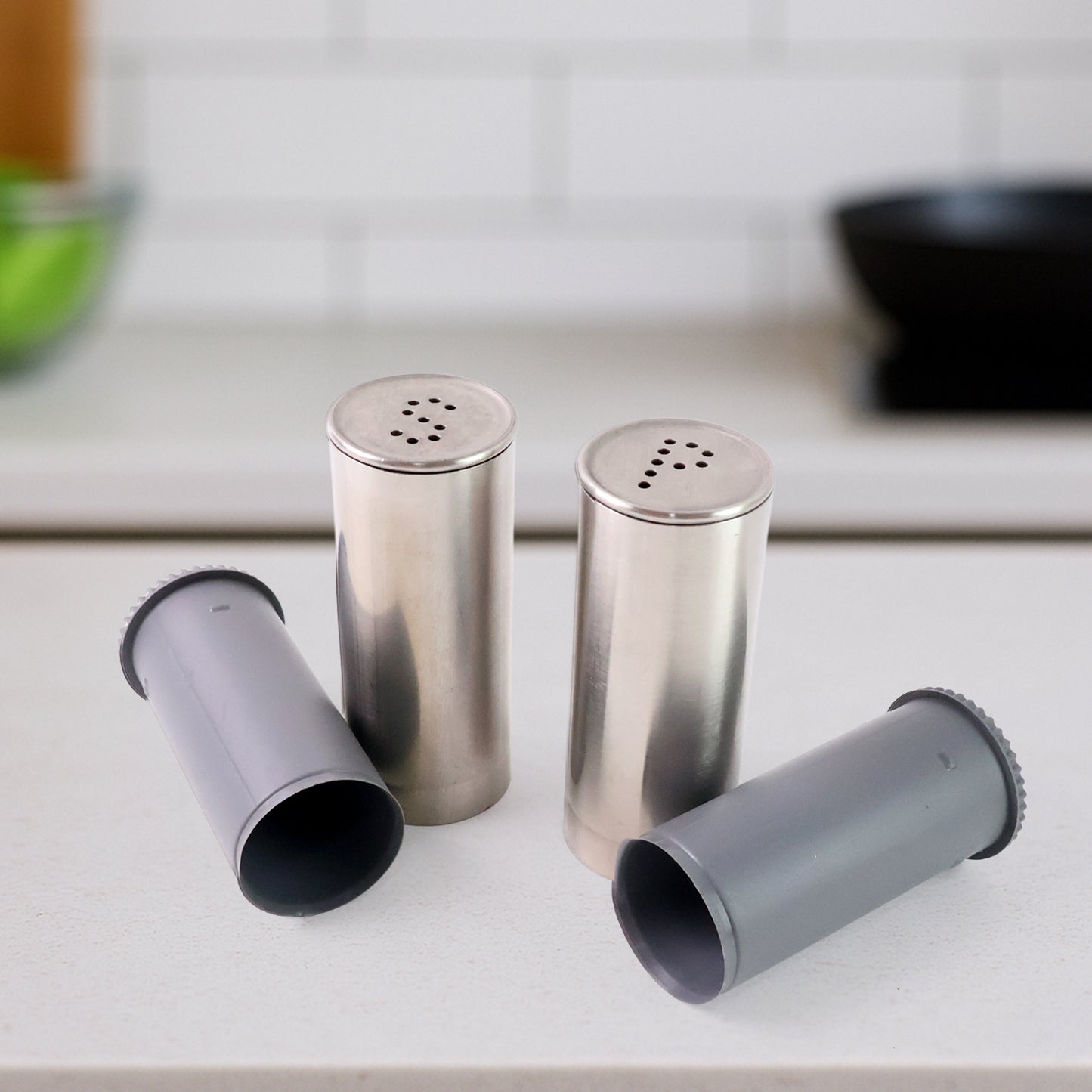 Wukusy stainless steel salt and pepper shaker set with two sleek, cylindrical shakers for kitchen or table use.