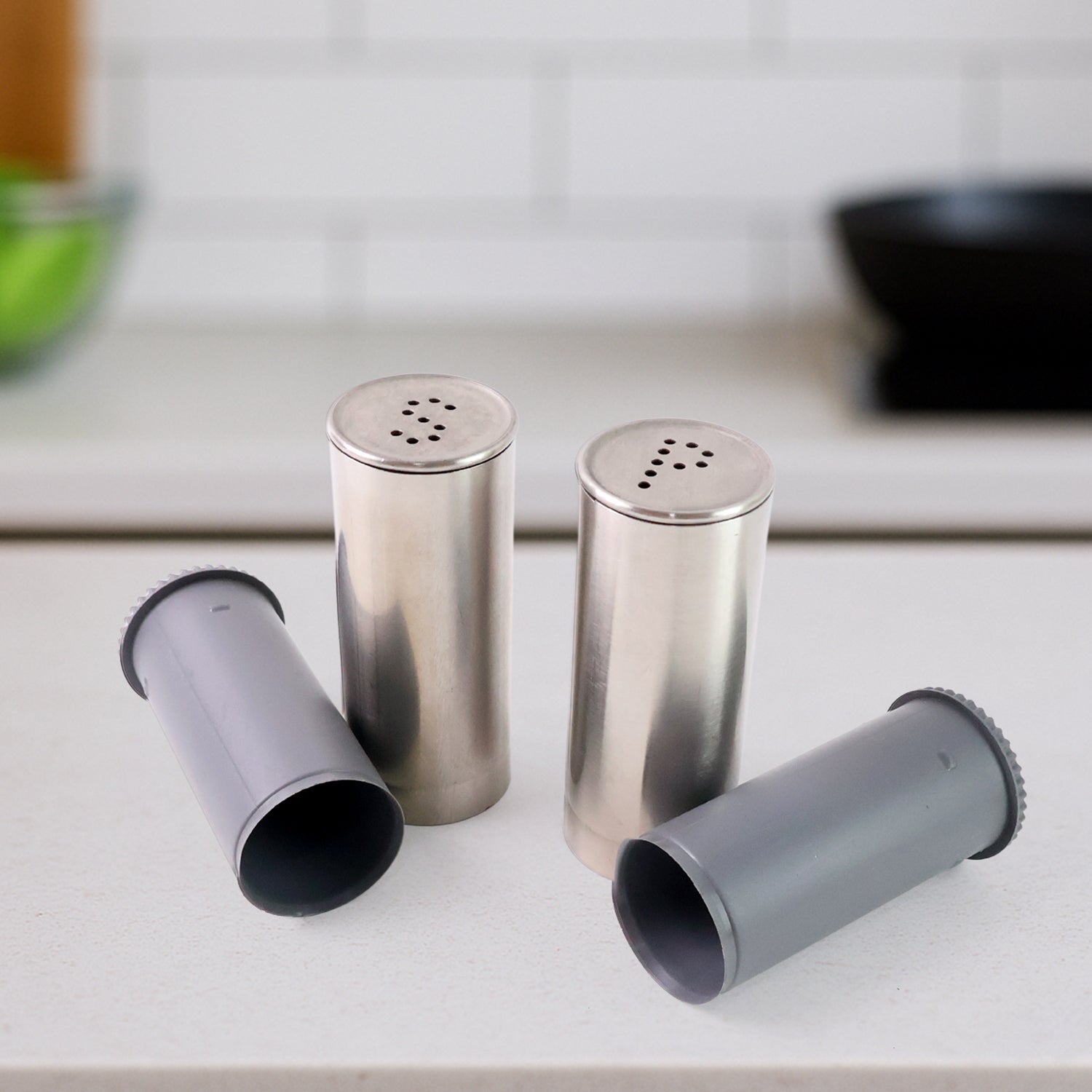 Wukusy stainless steel salt and pepper shaker set with two sleek, cylindrical shakers for kitchen or table use.