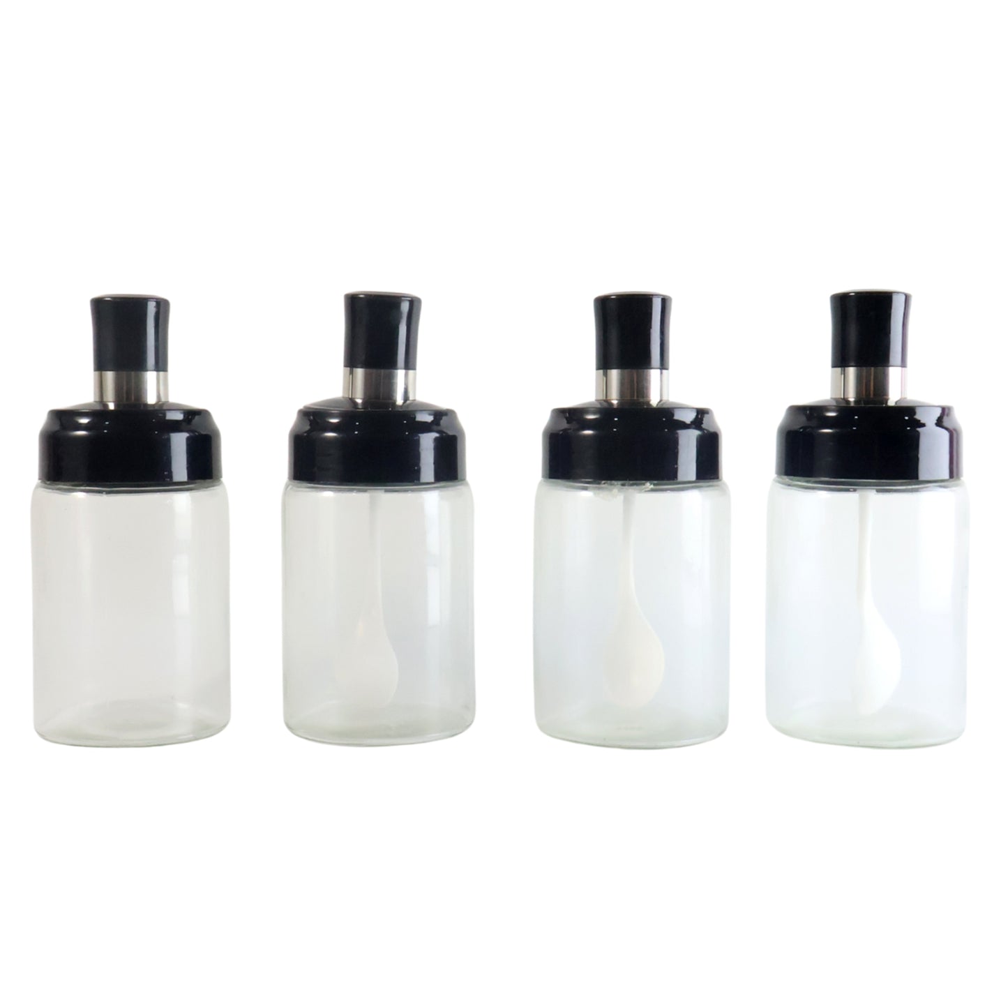 Set of four transparent Wukusy spice jars with airtight lids and spoons, ideal for organizing spices in a home kitchen.