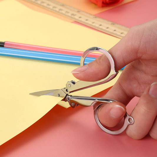 Wukusy 3.5-inch folding office scissors used for crafting and cutting by children and adults, with plastic handles and metal blades.