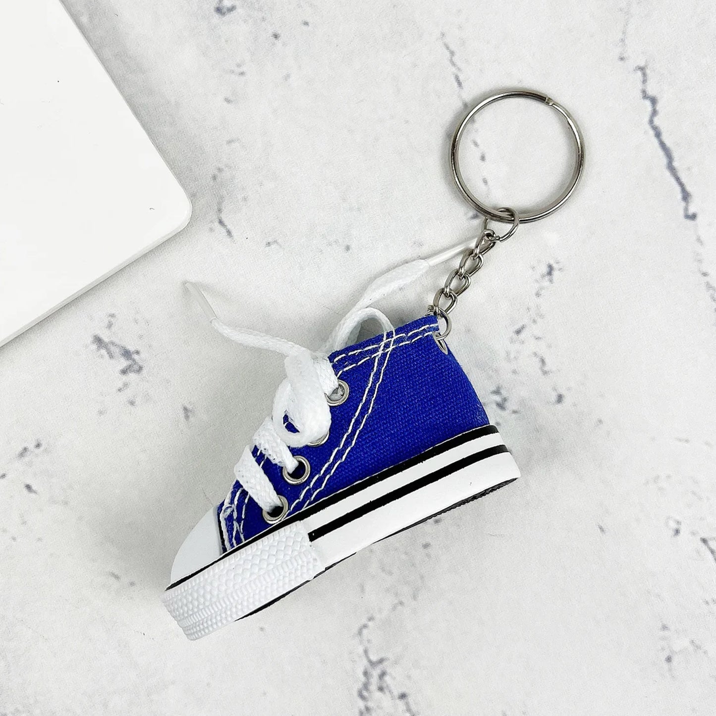 Wukusy mini shoes keychain, stylish travel accessory, attached to backpack, perfect gift, small decorative shoe charm for bags.