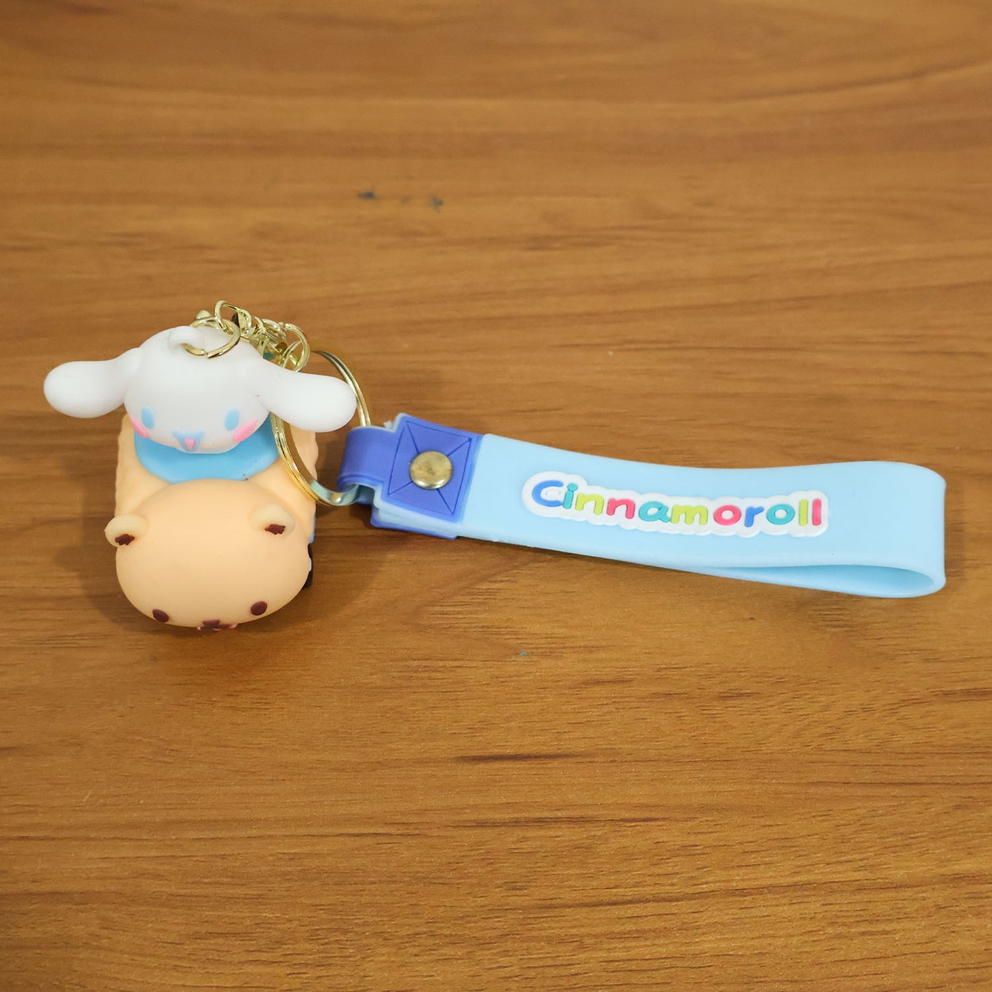 Cute cartoon dog character silicone keychain by Wukusy, featuring a colorful, playful dog design on a keyring.