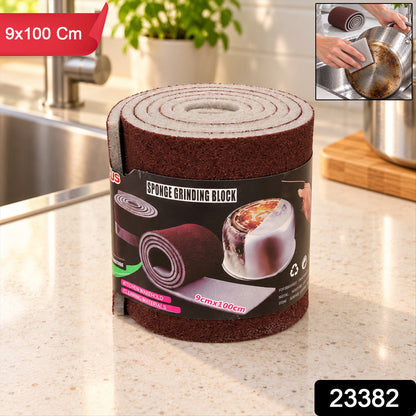 Wukusy abrasive sponge cleaning roll for kitchen pots and pans, 9x100 cm, shown rolled out for scrubbing surfaces.