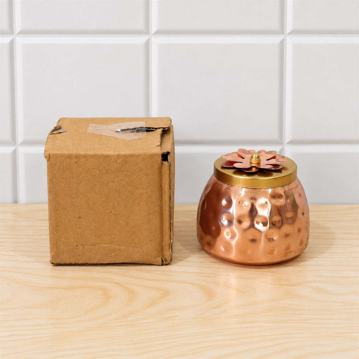 Wukusy copper finish storage jar with decorative flower lid for dry fruits and home decor, showcasing a elegant and functional design.