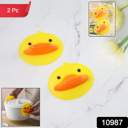 Pair of Wukusy cute duck-shaped silicone hot pot holders in bright yellow, designed to protect hands from hot cookware.