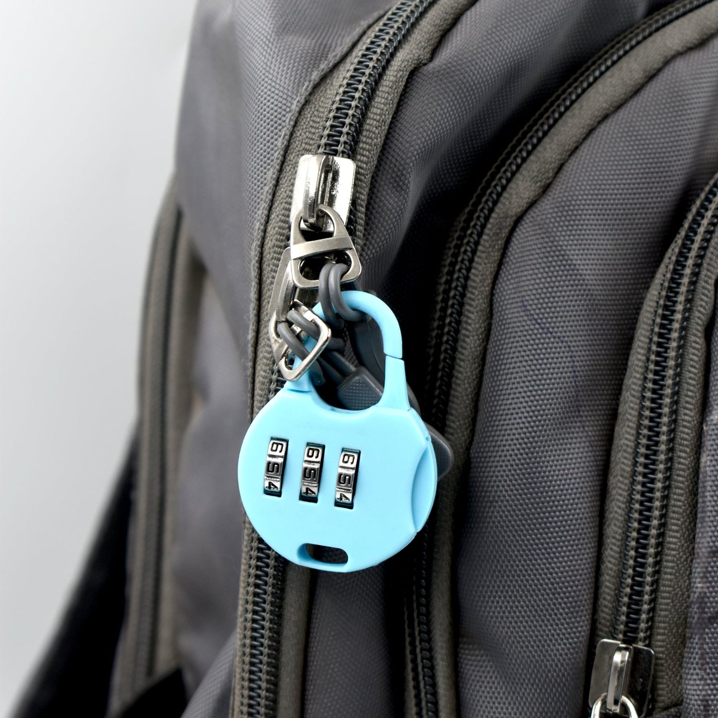 Wukusy 6108 3-digit zipper lock with zipper tool used for security purposes on various zipper materials.