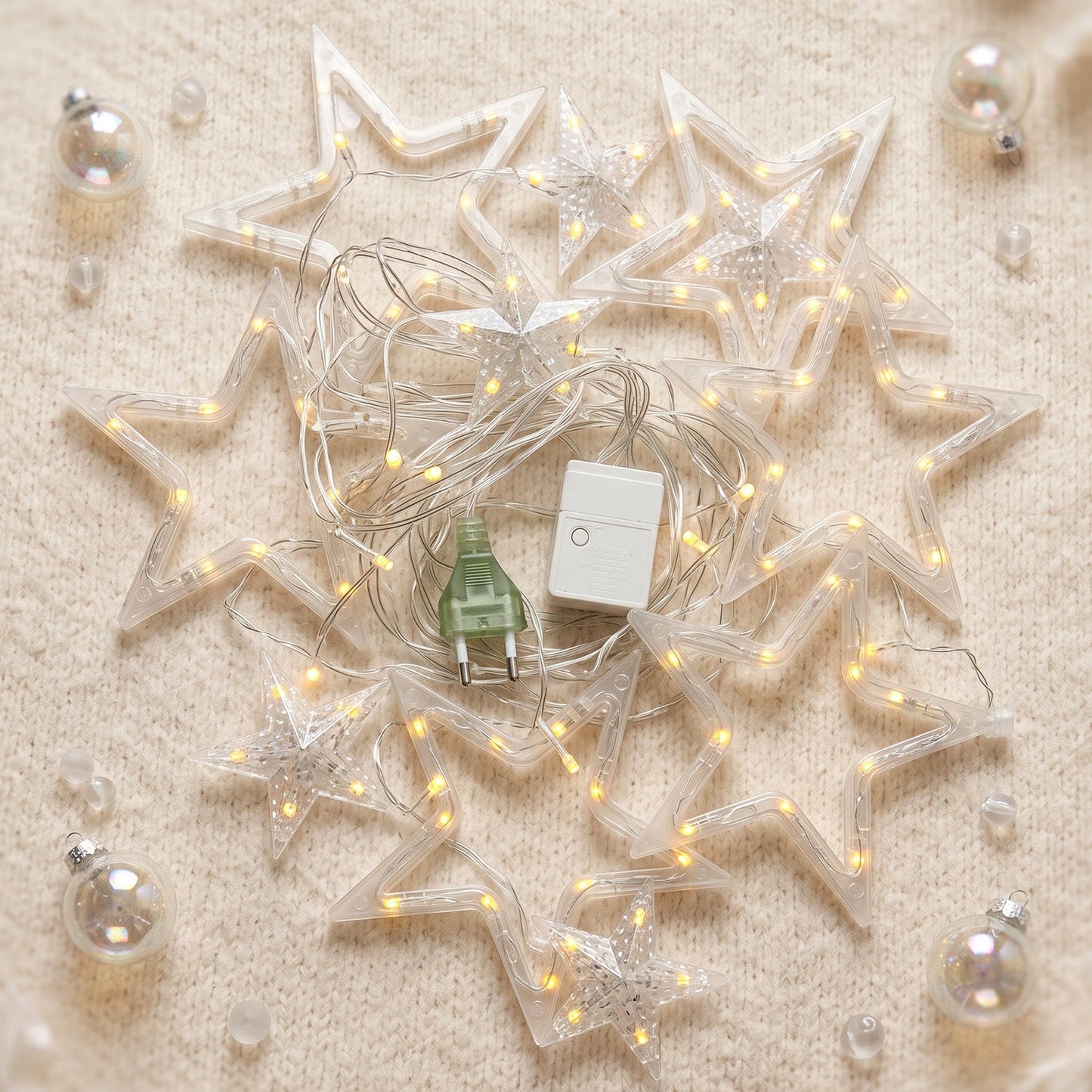 White star-shaped LED string light set by Wukusy, warm fairy lights for decorative use, shown draped across a surface.